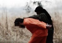 İŞİD-in 10 yaşlı cəlladı baş kəsdi